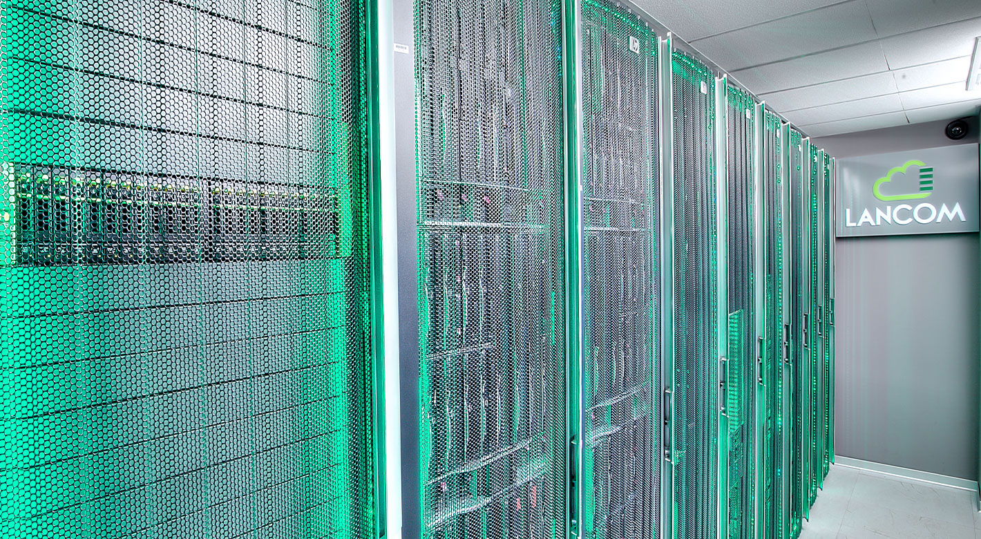 Server racks inside Lancom Athens Data Center with green network lighting and cooling infrastructure.